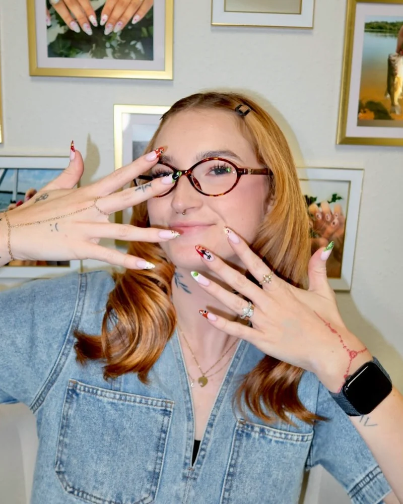 Camryn showing off a fresh set of hand-painted nails